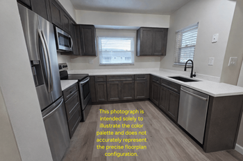 Elite upgrade package-featuring stainless steel appliances, premium cabinetry with modern black finishes, luxury quartz countertops, and vinyl plank flooring.